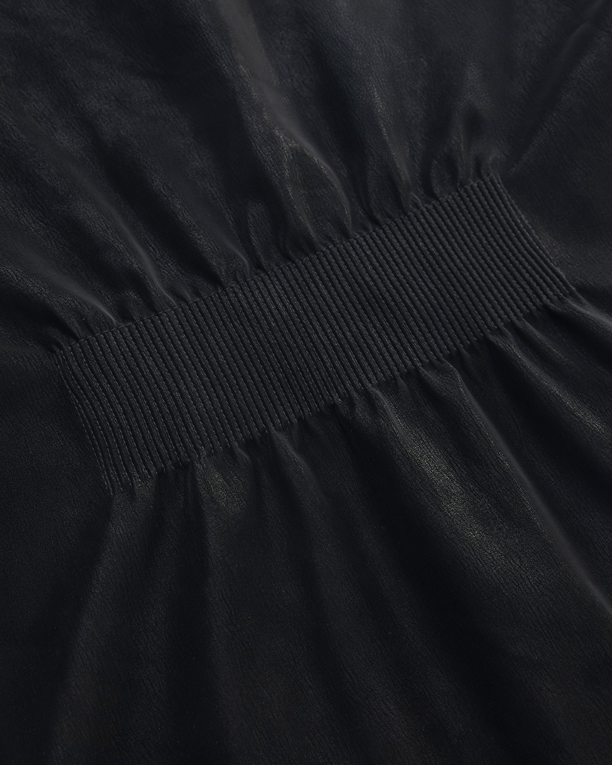 BACK PLEATED FAUX LEATHER COAT