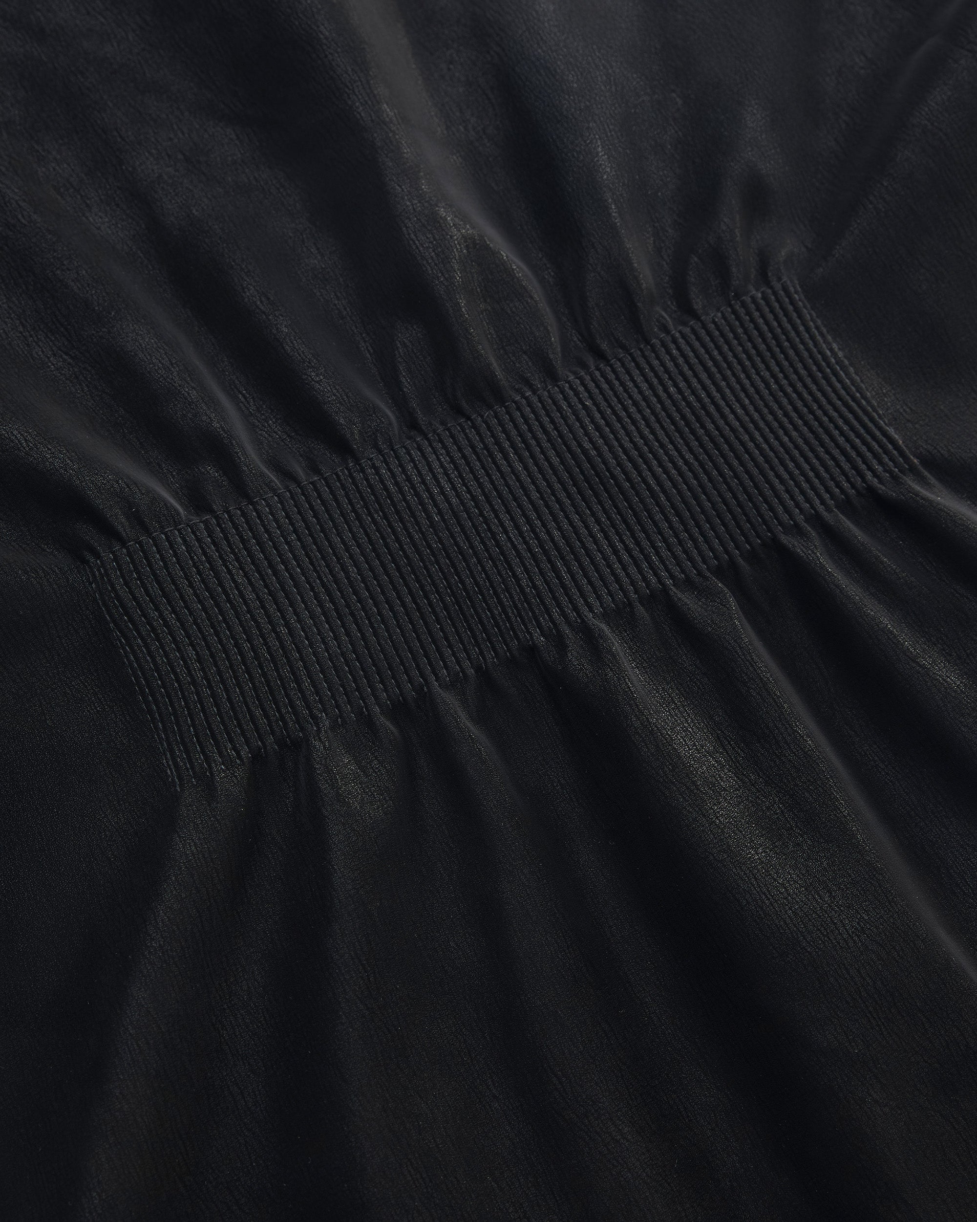 BACK PLEATED FAUX LEATHER COAT