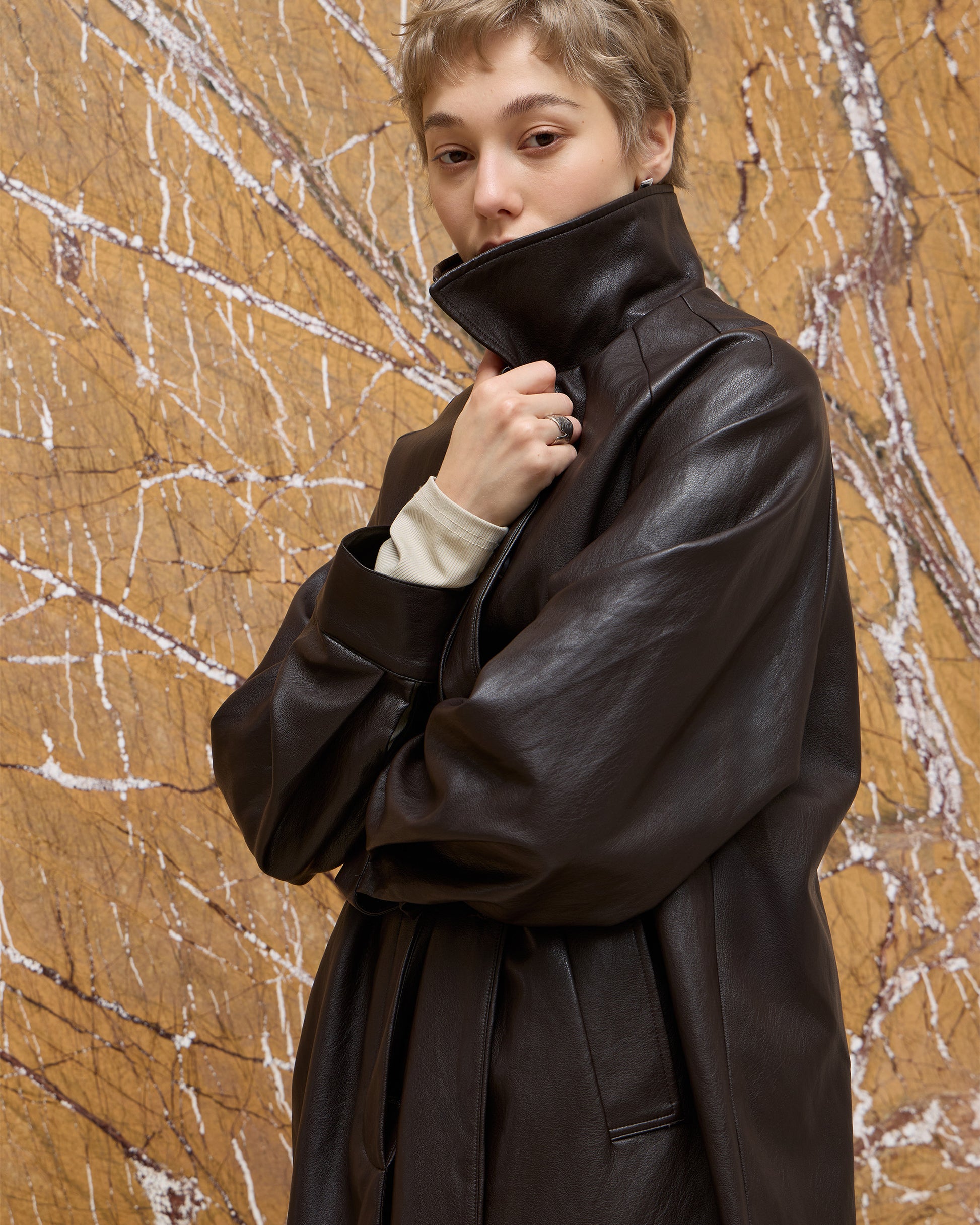 BACK PLEATED FAUX LEATHER COAT