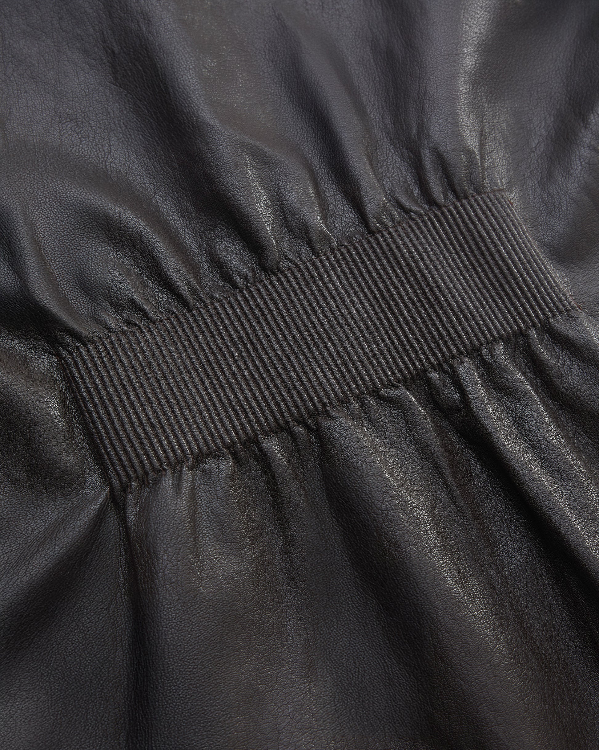 BACK PLEATED FAUX LEATHER COAT