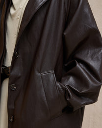 BACK PLEATED FAUX LEATHER COAT