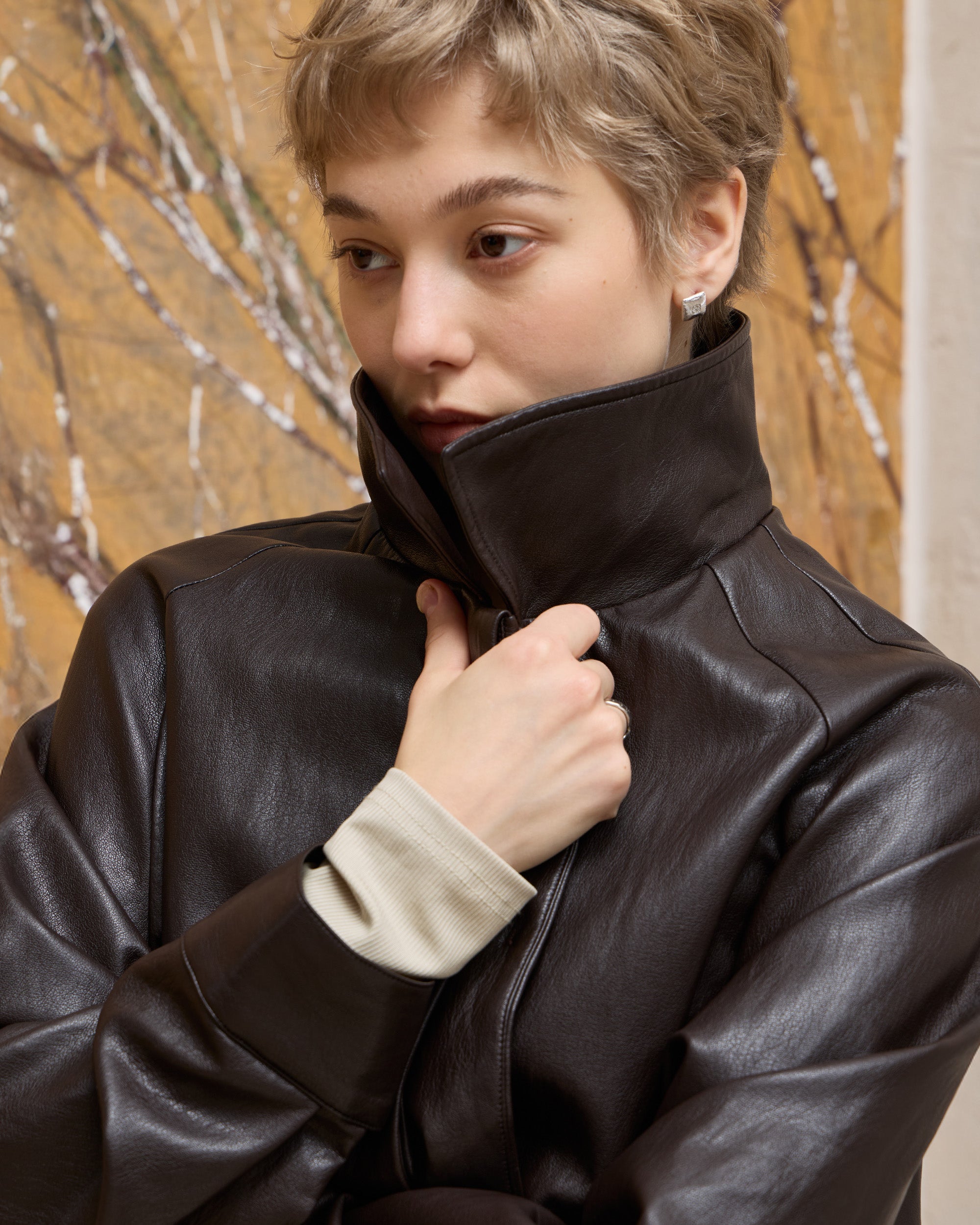 BACK PLEATED FAUX LEATHER COAT