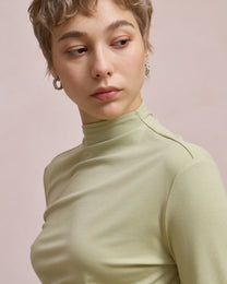 TWISTED MOCK NECK TOP