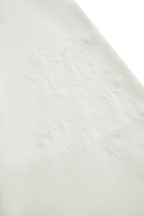 DRAPED EMBROIDERED ASYMMETRIC SKIRT