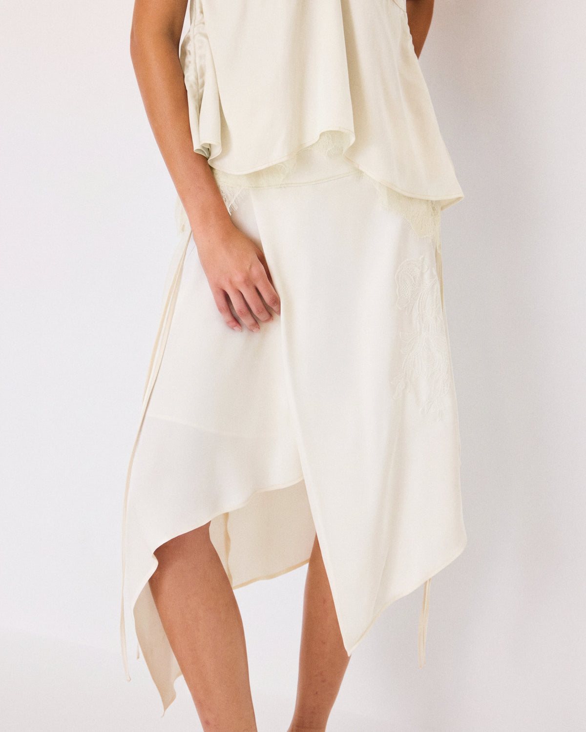 DRAPED EMBROIDERED ASYMMETRIC SKIRT