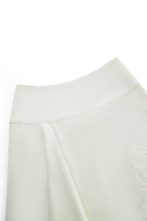 DRAPED EMBROIDERED ASYMMETRIC SKIRT
