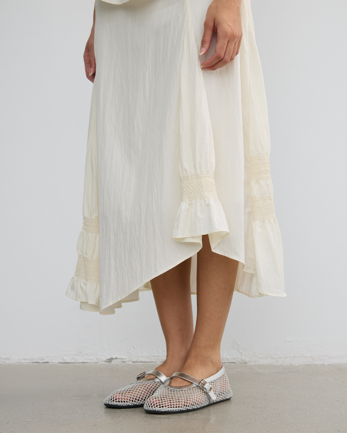 IRREGULAR PLEATED FLARE SKIRT