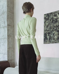 TWISTED MOCK NECK TOP